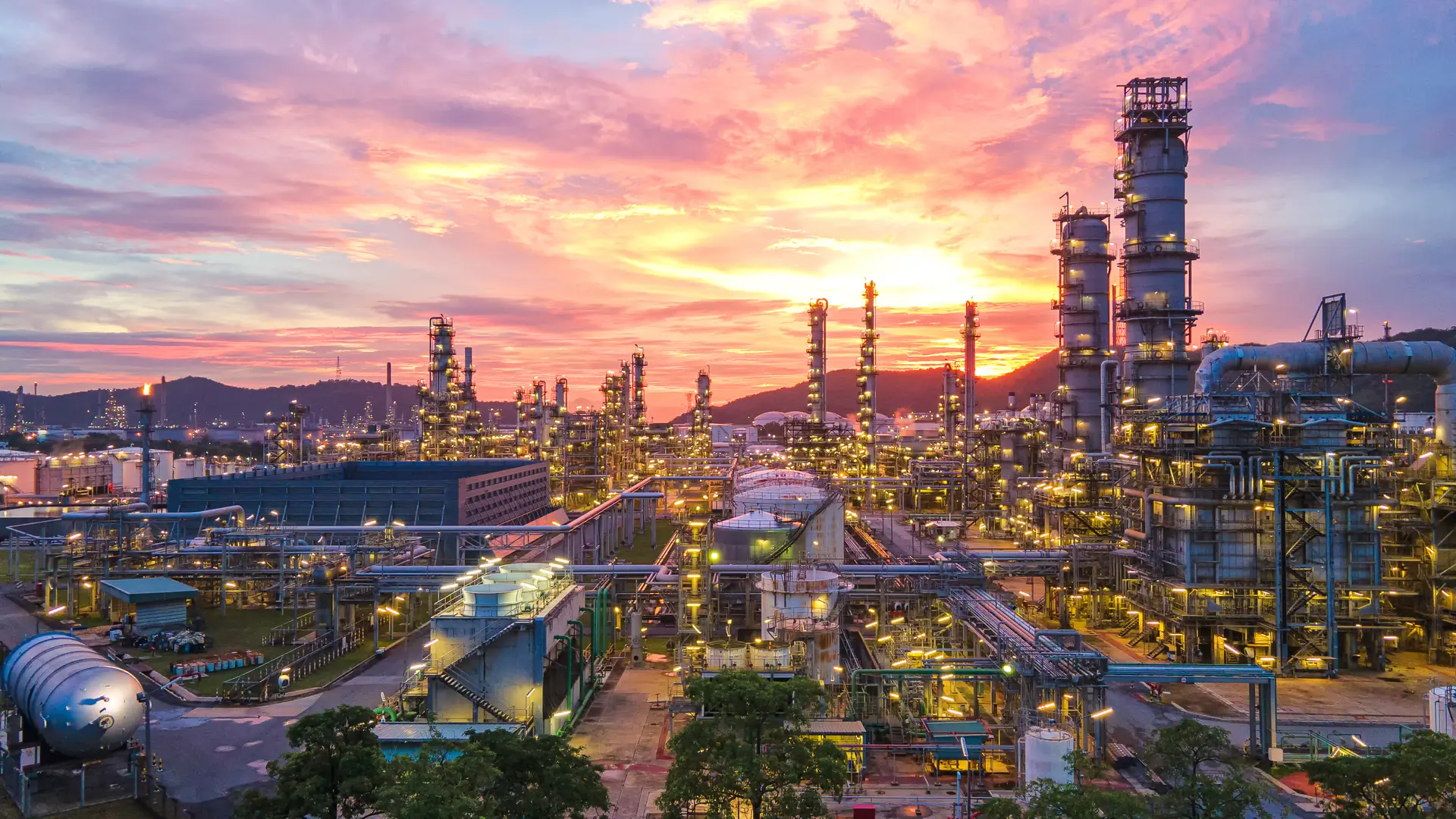 Oil and gas refinery at sunset