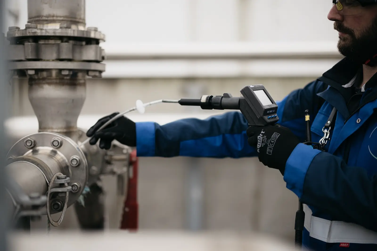 Technician inspecting an industrial valve